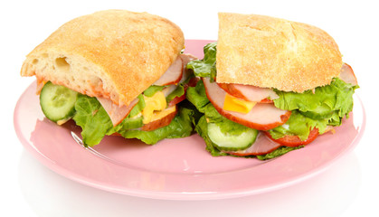 Sliced sandwich with ham and vegetables isolated on white