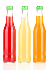 Bottles with tasty drink, isolated on white