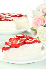 Cheesecake with fresh strawberry on white plate closeup