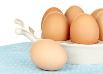 Eggs in plate for eggs isolated on white