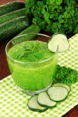 Green vegetable juice on table close-up