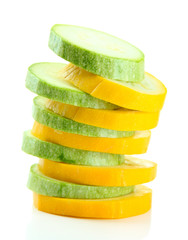Sliced raw zucchini, isolated on white