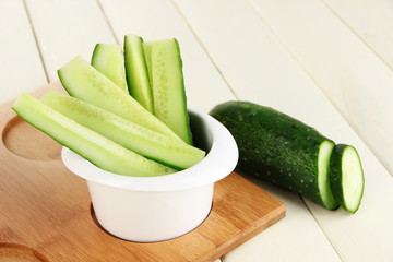Bright fresh cucumber cut up slices in bowl