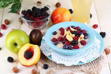 Oatmeal in plate with berries