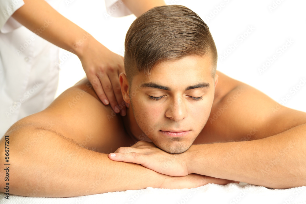 Wall mural Young man having back massage close up