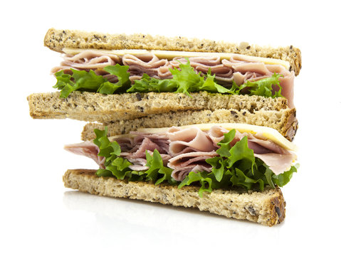 Fresh cut sandwich with ham, cheese and salad