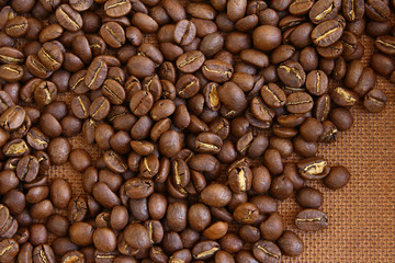 Coffee beans on grung wooden board background