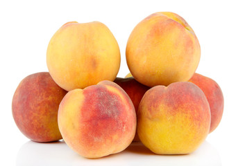 Ripe sweet peaches, isolated on white