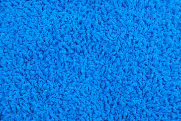 Fleecy blue pillow close-up background