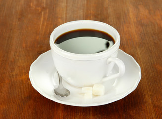 Coffee cup on wooden table close-up