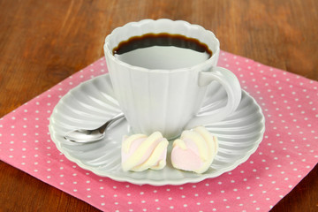 Coffee cup on wooden table close-up