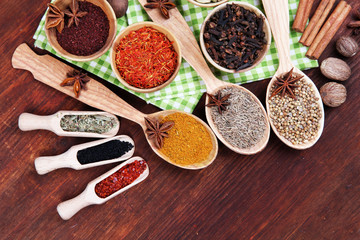 Various spices and herbs on wooden background