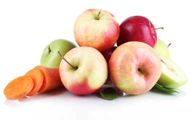 Sweet apples and carrot isolated on white