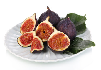 Ripe figs on plate  isolated on white