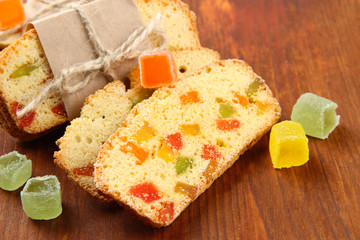 Biscotti with candied fruits, on wooden background