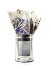 Tin Can full of Pound notes on a white background
