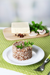 Buckwheat in plate and butter closeup