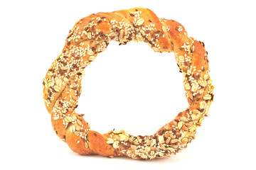 Bagel with various seeds isolated on a white