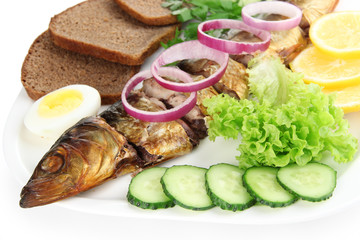 Smoked fish on plate close up