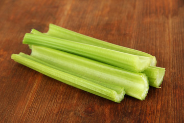 Fresh green celery on wooden background