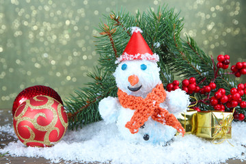Beautiful snowman and Christmas decor, on bright background