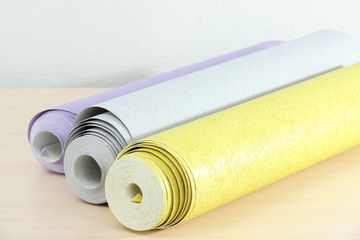 Wallpapers on wooden table in room