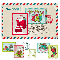 Obraz na płótnie Canvas Christmas Vintage Postcard with Postage Stamps