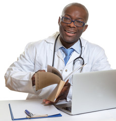 African doctor reading medical records