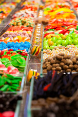 Market stall full of candys in La Boqueria Market.Barcelona