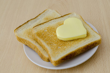 Heart shaped butter on toast