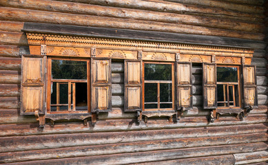 Fototapeta na wymiar Facade of Traditional Russian Old Wooden house