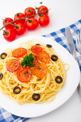 Pasta sliced with cherry tomatoes