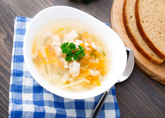 Bowl of chicken soup with vegetables and noodles