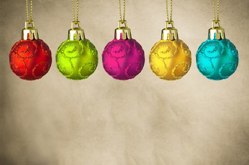 Row of Christmas Baubles on Parchment