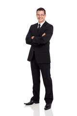 business man in a suit with arms folded