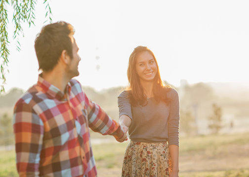 Couple Holding Hands Walking Away