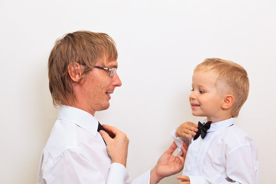 Father Teaching His Son To Tie Bow Tie