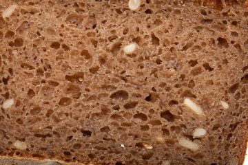 Slice of dark bread isolated over white