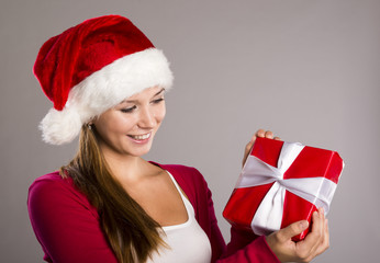 Beautiful christmas woman with gift