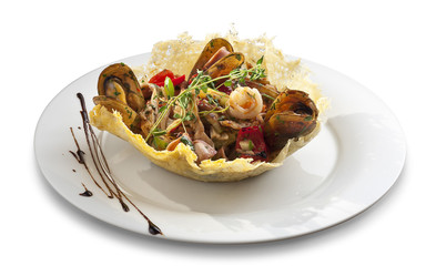 Mussles salad with vegitables in tortilla bowl shape