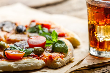Baked pizza and served with cold drink