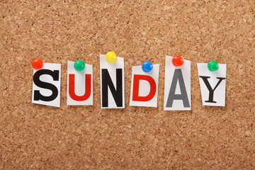 The word Sunday on a cork notice board