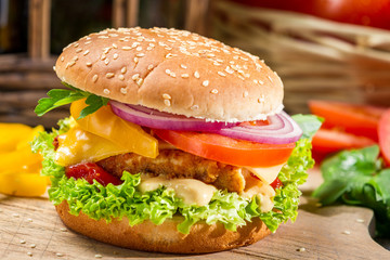Homemade hamburger with chicken, tomato  and onion