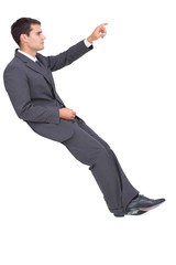 Businessman sitting and pointing the finger