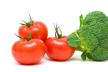 ripe tomatoes and broccoli close-up. white background.