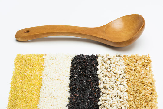 mixed rices and wooden tablespoon