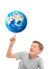 Boy holding planet earth on his finger