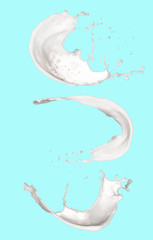 Obraz na płótnie Canvas splashing milk isolated on blue background
