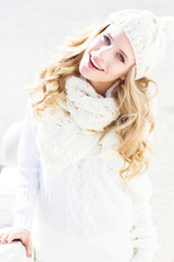Portrait of young beautiful woman wearing sweater and hat