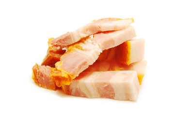 Pieces of smoked ham isolated on white